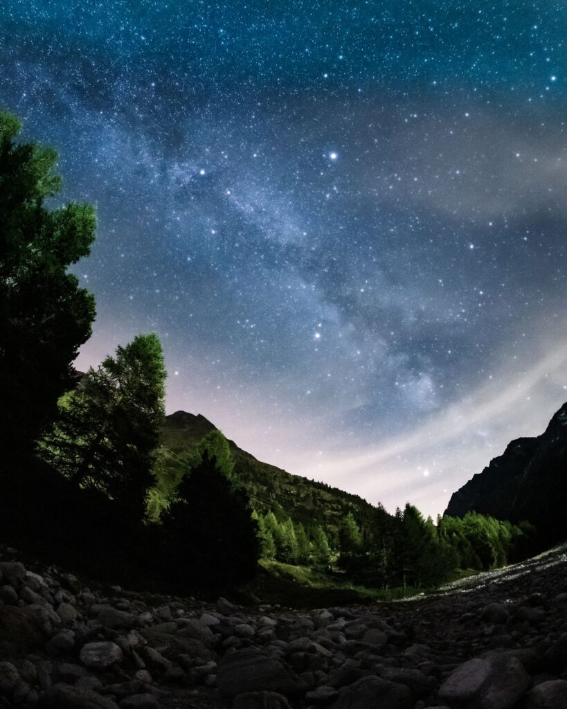 Starry night sky over mountains product photo