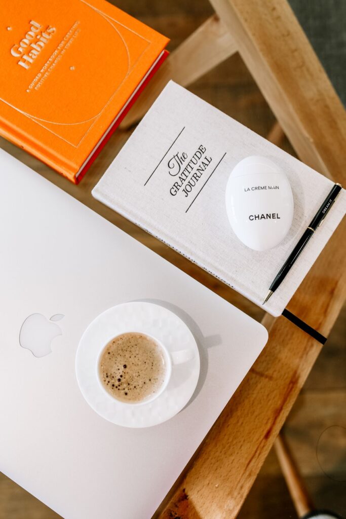 Cozy workspace with coffee and journal product photo