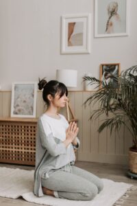Woman meditating at home product photo