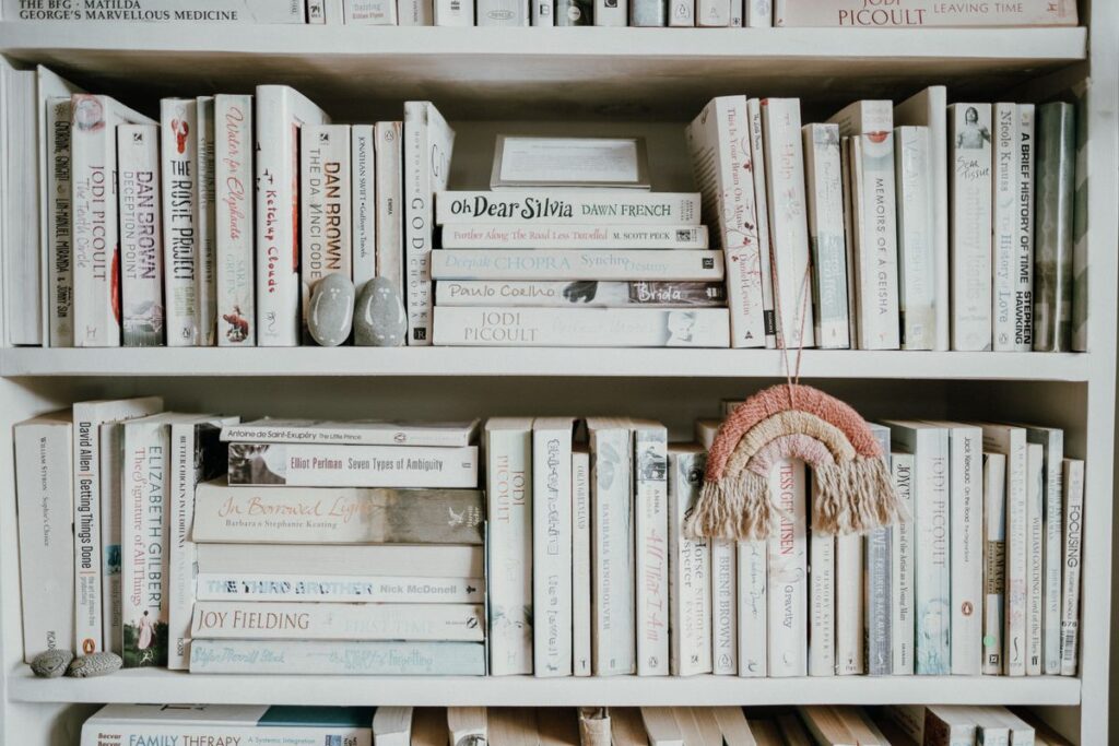 Collection of books in minimalist bookshelf product photo